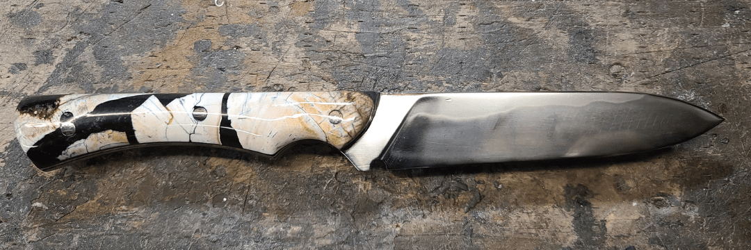 Custom handcrafted knife with marbled resin handle